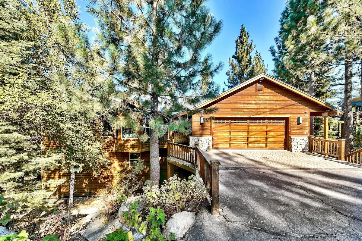 Wooden cabin nestled in pine trees at Lake Tahoe